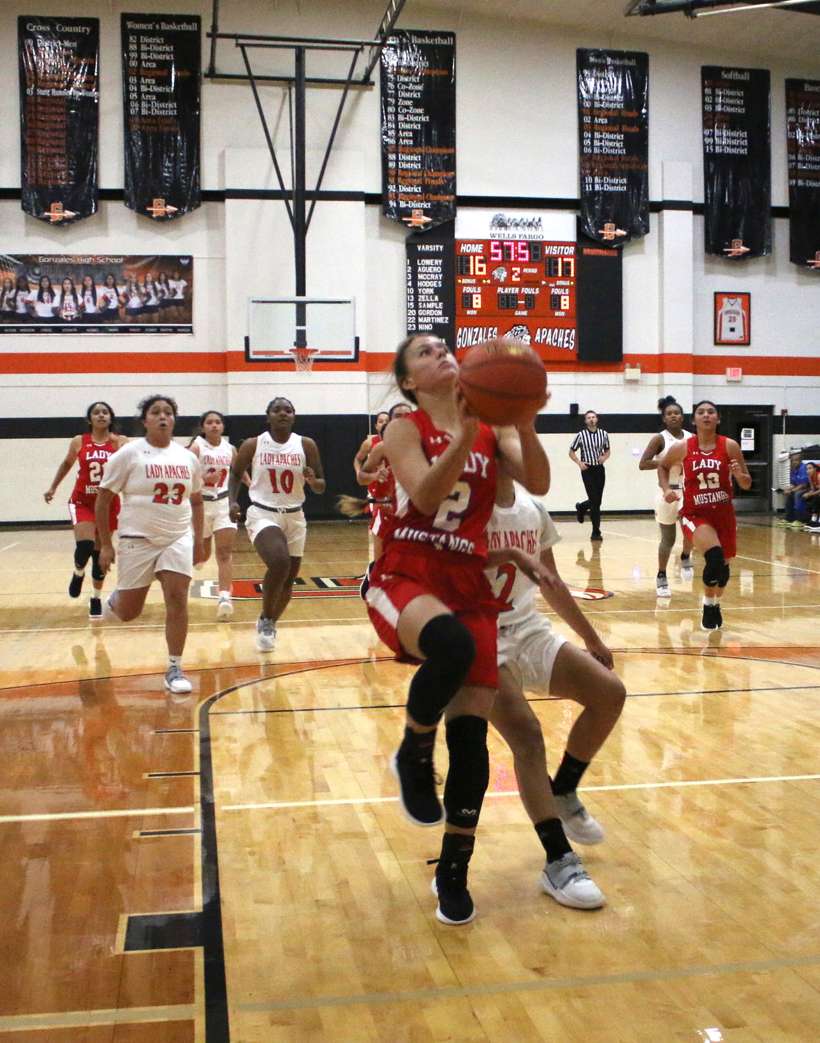 Greenlee Houseton drives to the hoop for a layup against the Lady Apaches.